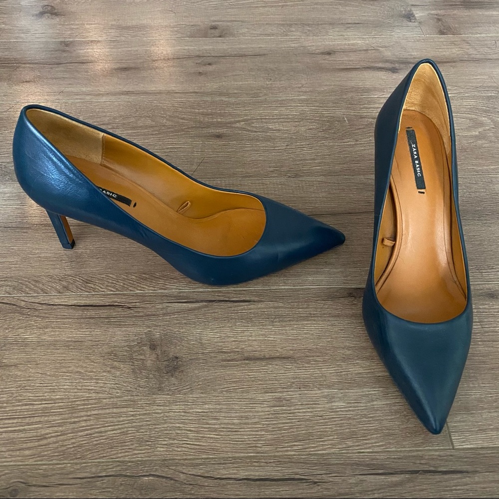 Navy blue leather pumps